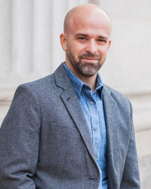 Portrait of Chris Meyer in a grey blazer